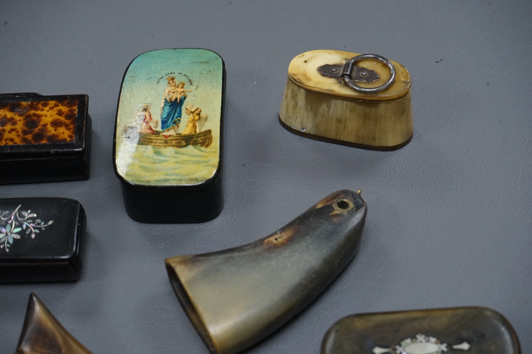Eleven assorted horn, lacquered and ebony snuff boxes, the majority 19th century, largest 8.5cm long.